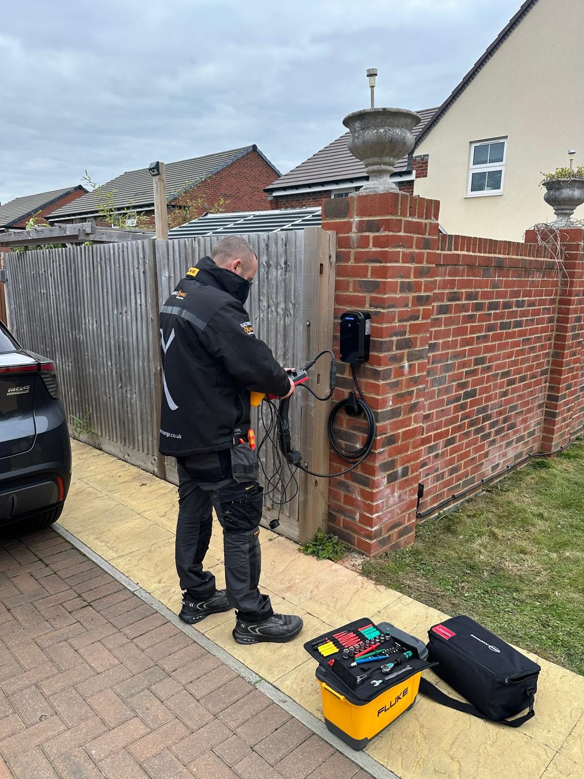 Electrical Exchange electrician at work on an EV charger installation