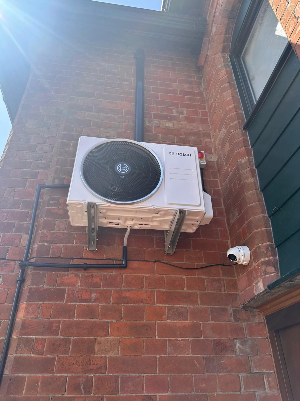 Bosch Climate 5.3i air conditioning outdoor unit installed on an exterior wall, Christchurch