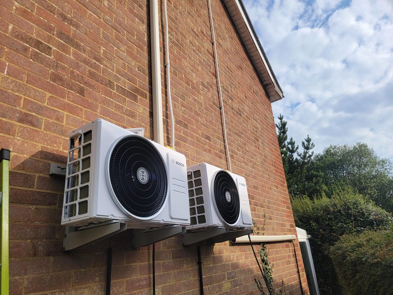 Bosch air conditioning outdoor units installed on a home